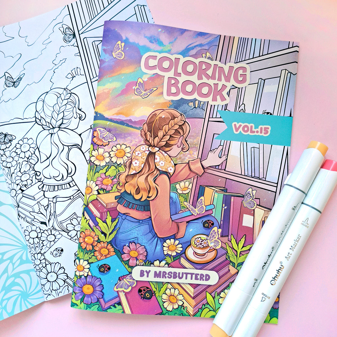 Coloring book with a girl by a window and two markers on a pink background