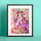 A framed art print featuring a colorful anime-style illustration of a girl in a pink kimono with a fox character, displayed against a mint green background.
